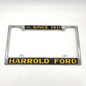 Vintage Harrold Ford Since 1911 License Plate Frame Chrome Metal Black Yellow